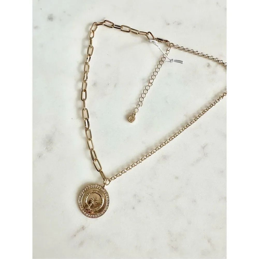 Gold serpent and star coin pendant necklace ￼